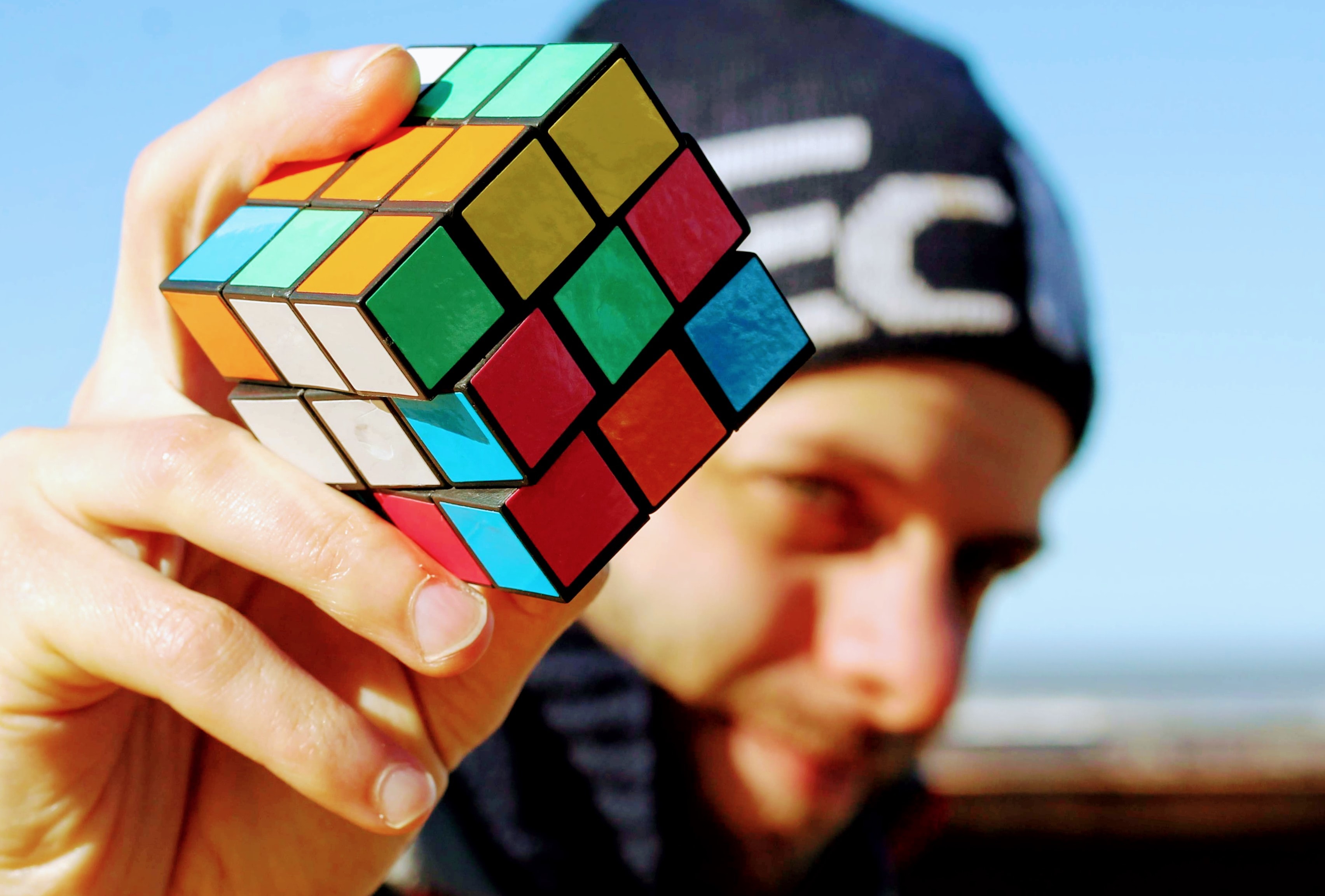 Man holding 3x3x3 Rubik's cube